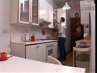 Shemale sex in a kitchen
